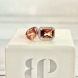 Radiant Silver Ring with Orange Gemstones